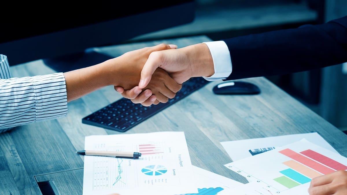Close up of business people handshake Is an agreement of doing b An invitation to our partners to take advantage of 2022 co-marketing opportunities for better success