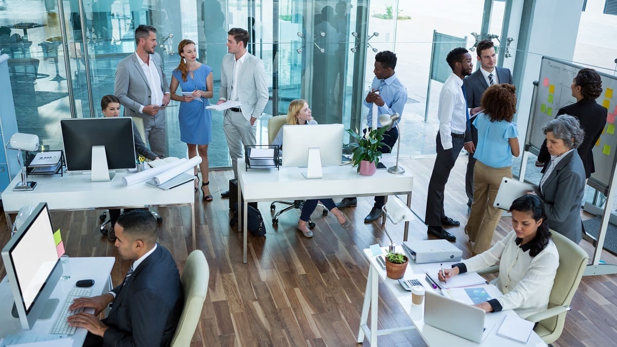 Businesspeople working in office Passive Optical LAN: What it is, how it works and why it benefits you