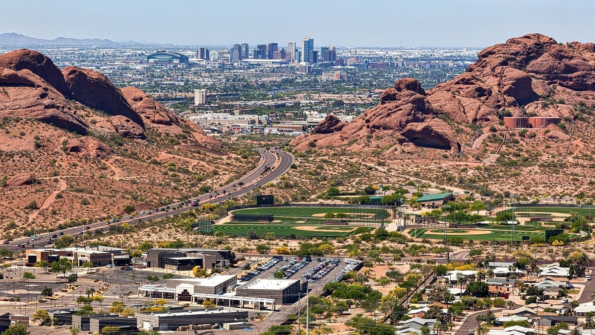 Downtown Phoenix aerial view from between the the Papago Buttes 2023 Smart City + IoT Conference featuring Optical LAN